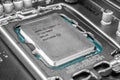 Moscow, Russia - January 12, 2022: Latest Intel i7 12700kf processor chip in socket on motherboard. Intel is one of the worlds
