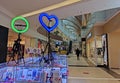 An ordinary ring lamp and a heart-shaped lamp on tripods in a shopping counter in the Vegas Mall