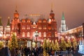 The State Historical Museum during Christmas time from Manege Square, tourists go sightseeing. Royalty Free Stock Photo
