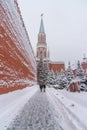 View of Kremlin wall and Nikolskaya Tower. People go to Lenin`s Mausoleum near Kremlin wall in winter. Moscow. Russia Royalty Free Stock Photo