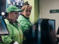 Moscow, Russia - January 17, 2020: Vkusvill store employees at cash register. Vkusville is Russian retail chain of supermarkets