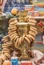 Moscow, Russia - January 10. 2018: Window shop in GUM shapping mall with russian samovar, cookies and round-shaped cracknel