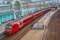 Moscow, Russia - July 2019. Aeroexpress. Railway, ancient architecture, top view from the bridge to the red train