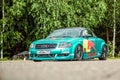 Moscow, Russia: July 06, 2019: Audi TT red bull racing on the parking near the forest. Green color painted tuned and low sport car