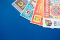 Moscow, Russia, July 2020: Close up of various Russian lottery tickets on a blue background. Russian Lotto Royalty Free Stock Photo