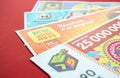 Moscow, Russia, July 2020: Close up of various Russian lottery tickets on a red background. Russian Lotto Royalty Free Stock Photo