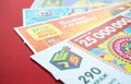 Moscow, Russia, July 2020: Close up of various Russian lottery tickets on a red background. Russian Lotto Royalty Free Stock Photo