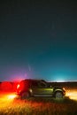 Comet Neowise C 2020 F3 In Night Starry Sky Above Renault Duster SUV In Summer Agricultural Field Landscape.