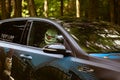 Moscow, Russia - July 13, 2019: Crazy clown inside a tuned car in the forest