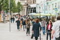 Moscow, Russia - JULY 7, 2017. A crowd of people in colorful clothes walk the streets of Moscow in search of