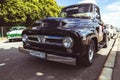 front corner view of Ford F100 Pickup Truck 1955 parked on street