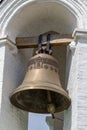 Moscow / Russia - July 22, 2013: large ringing bell on a white bell tower.