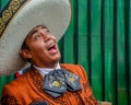 Moscow, Russia - July 7, 2018: Mexican street musician mariachi in traditional clothes and sombrero sings a serenade