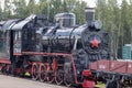 Moscow, Russia - July 28, 2019: An old black Soviet steam locomotive with a red star on the hull stands on the platform of the Royalty Free Stock Photo