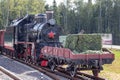 Moscow, Russia - July 28, 2019: An old black Soviet steam locomotive with a red star on the hull stands on the platform of the Royalty Free Stock Photo