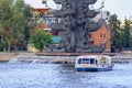 Moscow, Russia - July 30, 2018: Pleasure boat floating on a background of Statue of russian Tsar Peter the Great on a sunny summer