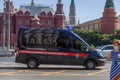 MOSCOW, RUSSIA - JULY 23, 2020: Police car of the Investigative Committee of Russia in front of the Kremlin towers of Red Square Royalty Free Stock Photo