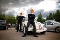 Moscow, Russia: July 06, 2019: Restored Volkswagen beetle stylized number 53. The Weasley Brothers are standing nearby. Cosplay on Royalty Free Stock Photo