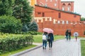 Moscow, Russia - JULY 7, 2017. Several groups of people walk along a street near the Kremlin in Moscow. They are holding
