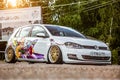 Moscow, Russia: July 06, 2019: Tuned by low suspension and custom wide golden colored wheels. White volkswagen golf 7 with