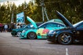 Moscow, Russia - July 06, 2019: Two tuned Audi TTs. One wrapped with a special turquoise vinyl film. The car is sponsored by red