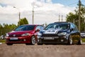 Moscow, Russia - July 06, 2019: Two Volkswagen Golf red and black. Tuned and stock, factory unchanged. Tuned car with lowered Royalty Free Stock Photo