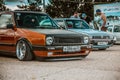 Moscow, Russia - July 06, 2019: Volkswagen Golf 2 yellow-brown in the parking lot. classic car with lowered suspension and Royalty Free Stock Photo