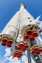 Moscow, Russia - July 22, 2019: White soviet space rocket Vostok with red engines nozzles in VDNH park in Moscow against blue sky