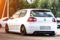 Moscow, Russia - July 06, 2019: White tuned Volkswagen Golf MK5. The back of the car with lowered suspension. and black rims. GTI