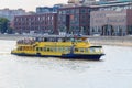 Moscow, Russia - July 30, 2018: Yellow pleasure boat floating on Moskva river on a sunny summer day