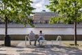 Moscow, Russia, 02 June 2019. Art Museum Park. Elderly and young men sitting in a city Park by the river