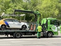 Moscow, Russia, June, 01, 2022. Carsharing car `Yandex Drive` was loaded onto a tow truck on the street of the Soviet Army in Mosc