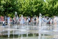 Children bathe in the jets of the fountain in the Muzeon Park. Royalty Free Stock Photo