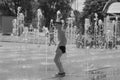 Moscow. Russia. June 19, 2019. Children bathing in a refreshing spray of the city fountain on a hot summer day