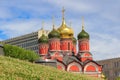 Moscow, Russia - June 21, 2018: Domes of Mother of God Sign of Former Znamensky Monastery in Moscow against green lawn in Zaryadye Royalty Free Stock Photo