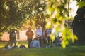 End of the school year picnic of classmates amid poplar fluff in Kolomenskaya public park