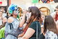 Celebration of the Day of the Dead. Girl with makeup doing face painting to another girl Royalty Free Stock Photo