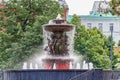 Moscow, Russia - June 02, 2019: Fountain Vitali on Revolution Square in Moscow against green trees closeup Royalty Free Stock Photo