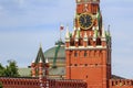 Moscow, Russia - June 21, 2018: Fragment of Spasskaya tower and Moscow Kremlin wall closeup against blue sky Royalty Free Stock Photo