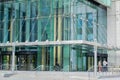 Moscow, Russia, June 2020: Glass entrance to a modern office building with people inside and near it Royalty Free Stock Photo