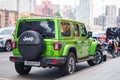 Green Jeep Wrangler Unlimited 4x4 SUV car parked on the street in the city Royalty Free Stock Photo