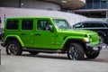 Green Jeep Wrangler Unlimited 4x4 SUV car parked on the street in the city Royalty Free Stock Photo