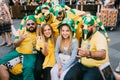 MOSCOW, RUSSIA - JUNE 2018: A group of Brazilian football fans are photographed with Russian girls on the street during