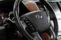 MOSCOW, RUSSIA - JUNE 20, 2021 Infiniti company logo close-up view on the steering wheel.