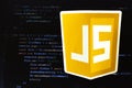 Moscow, Russia - 1 June 2020: JavaScript JS logo sign with program code on background Illustrative Editorial