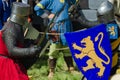 MOSCOW,RUSSIA-June 06,2016: Medieval warriors fight on duel. Knights struggle in armour with swords and shields in there hands