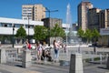 Moscow, Russia - June 23. 2022. Muscovites with children at the fountain in the heat. Central square in Zelenograd