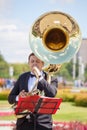 New Life Brass band, wind musical instrument player, orchestra performs music, man musician plays big sousaphone, trumpeter Royalty Free Stock Photo