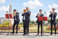 New Life Brass band, wind musical instrument players, orchestra performs music closeup, four musician men play trumpets, trombones