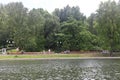 Moscow. Russia. June 15, 2022. People rest on the embankment of the pond in the city park on a sunny day. Royalty Free Stock Photo